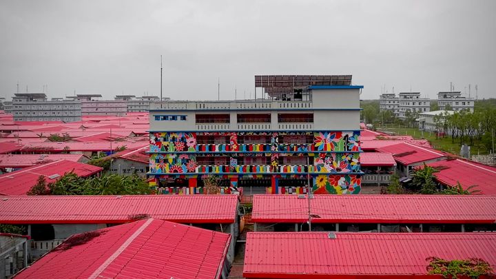 Image of Bhasan Char with distinctive red roofs on buildings. 