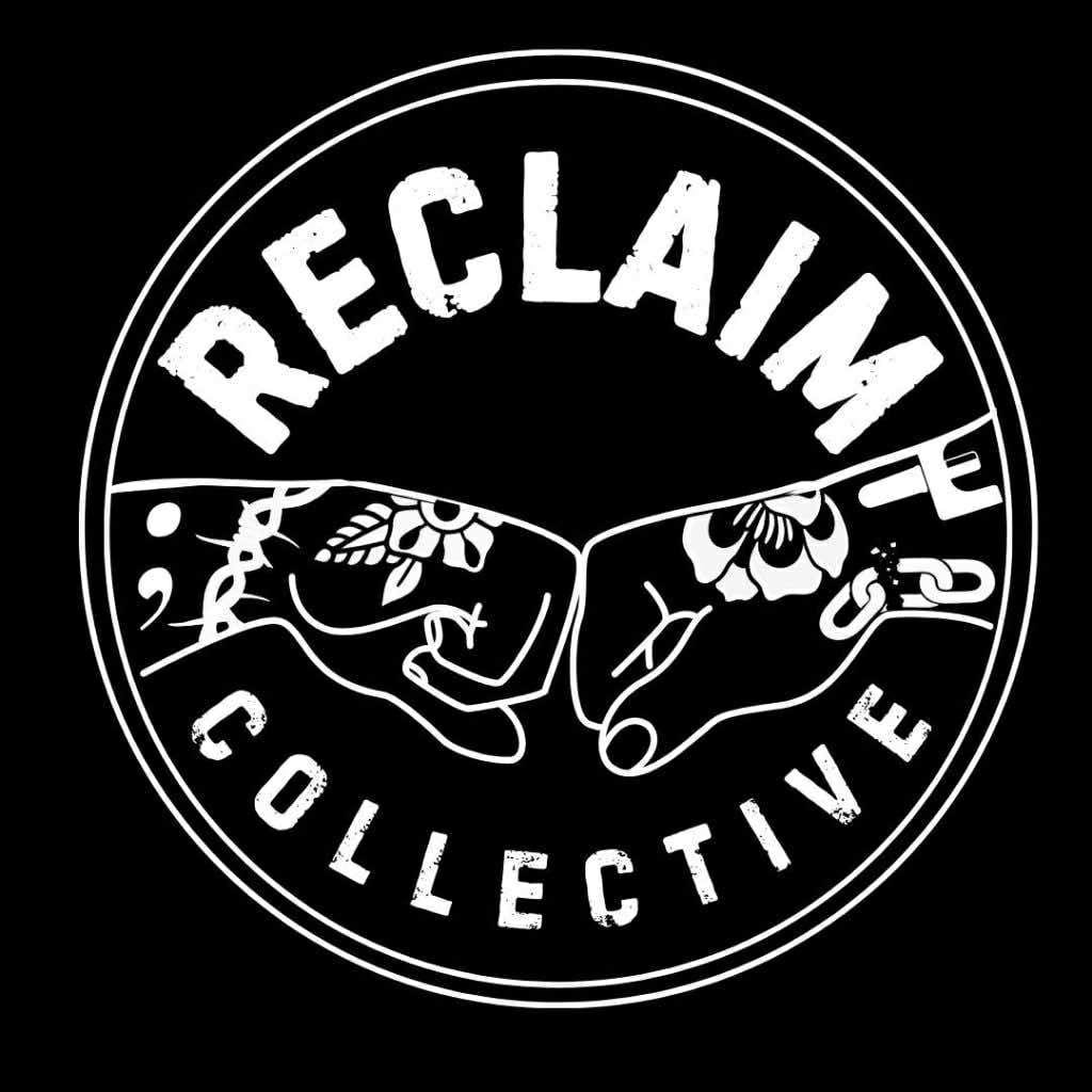 A white logo on a black background, reading "RECLAIM Collective." The lettering looks urban, like it is painted on concrete, and traces a circle around two fists meeting in the centre. The fists are decorated with various symbols including chains breaking.