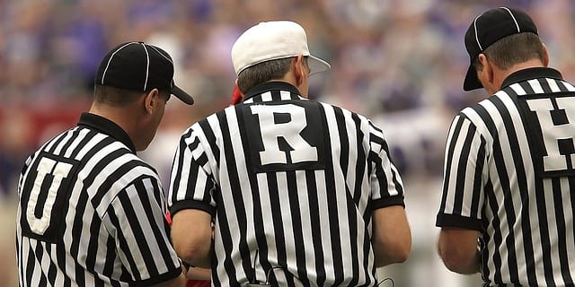 american football referees making a decision