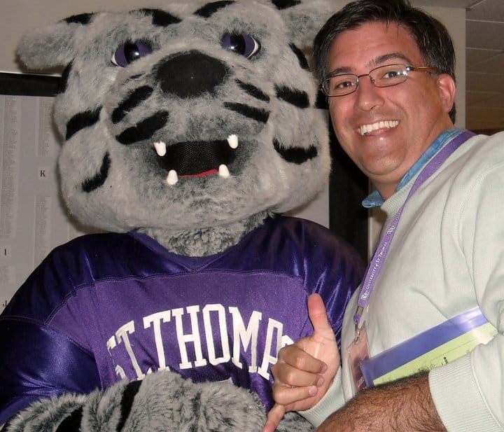 a pic of Greg with the mascot of St Thomas - the Doubting Tiger