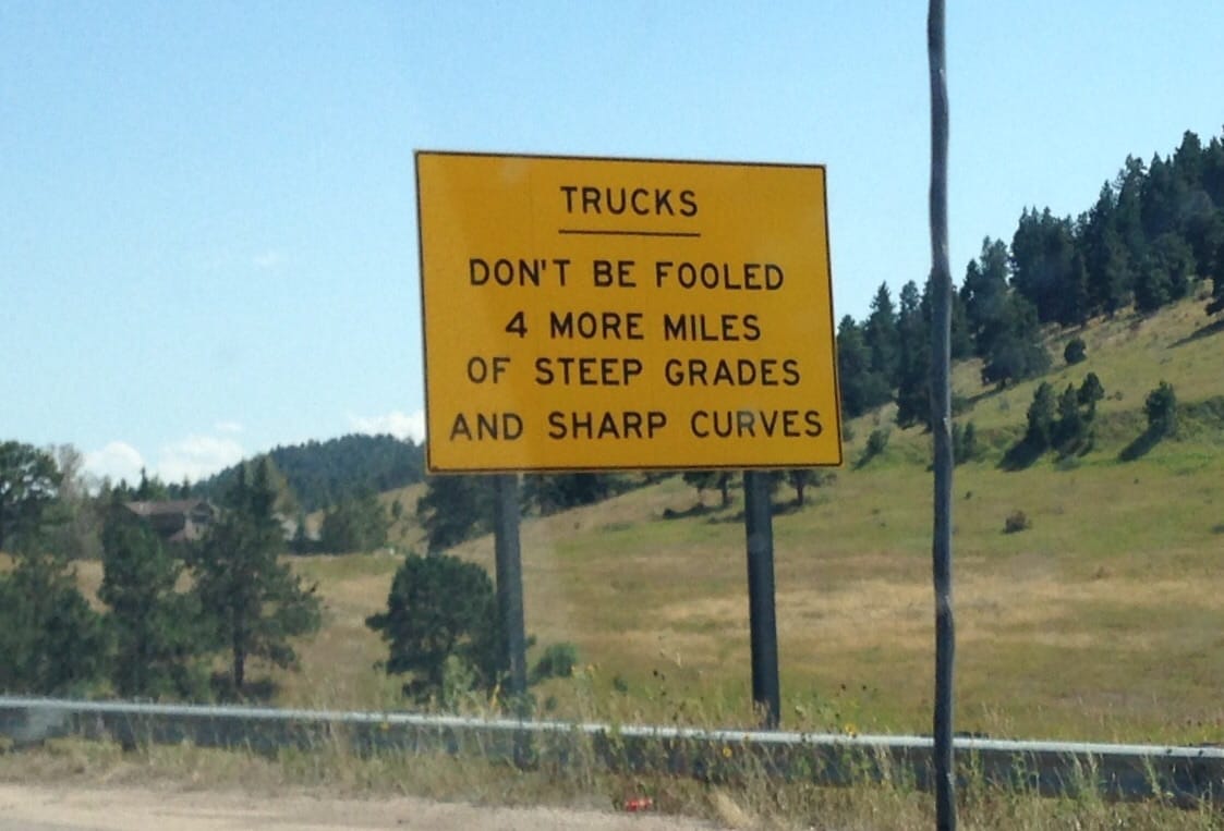 image from PrinterBill of a sign on i70 approaching Denver - trucks don't be fooled, steep grade ahead