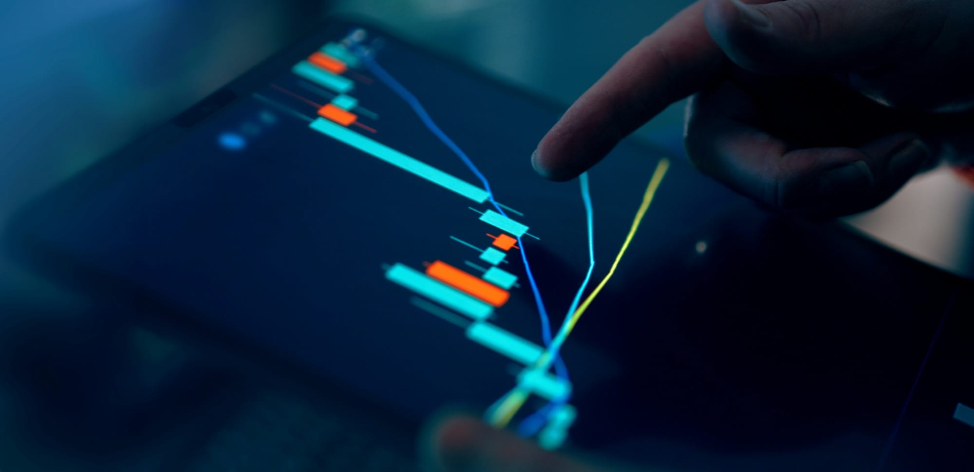 person pointing to a graph to show attribution and project results into the future