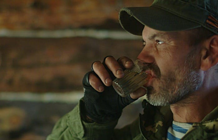 eccentric man drinking vodka