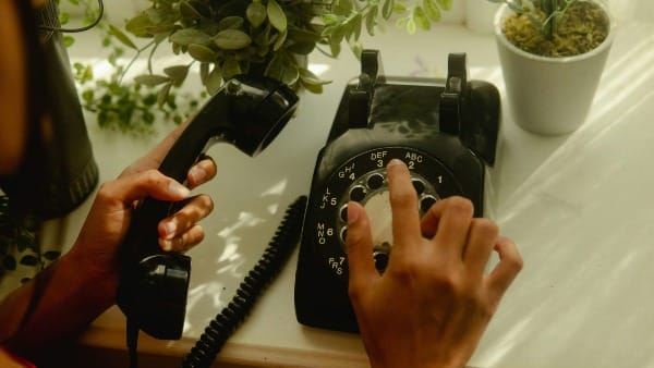 image of rotary phone being dialed to make a presentation of the proposal