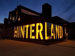 Green Bay WI Hinterland Brewery sign at night - the best place to be for a Packer game