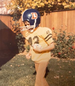 young greg chambers in a broncos uniform and bell bottoms sometime in the 1970s