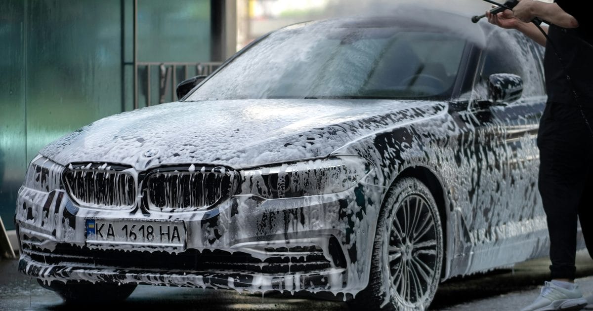 Car covered in soap suds at a car wash