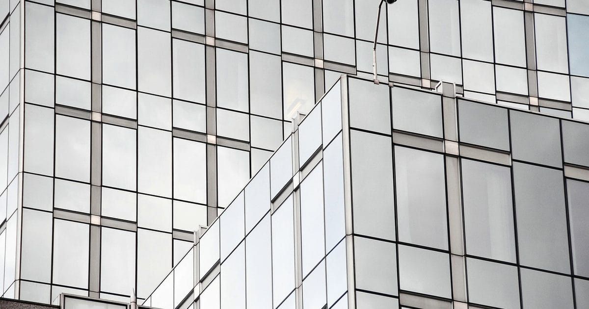 Glass curtain-wall facade of a modern office building