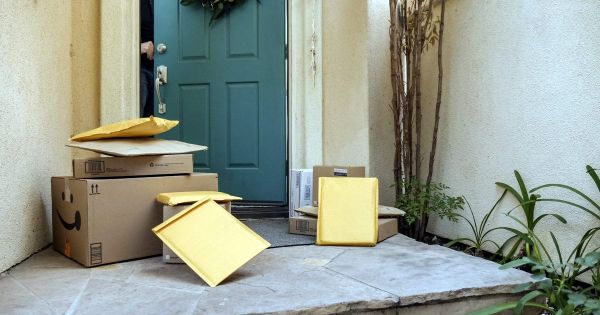 Delivery packages stacked on a front porch