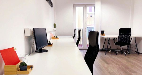 Bright coworking space with colorful chairs