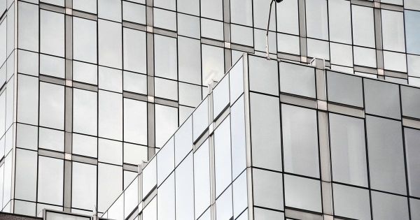 Glass curtain-wall facade of a modern office building