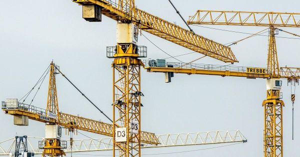 Tower cranes over a building under construction