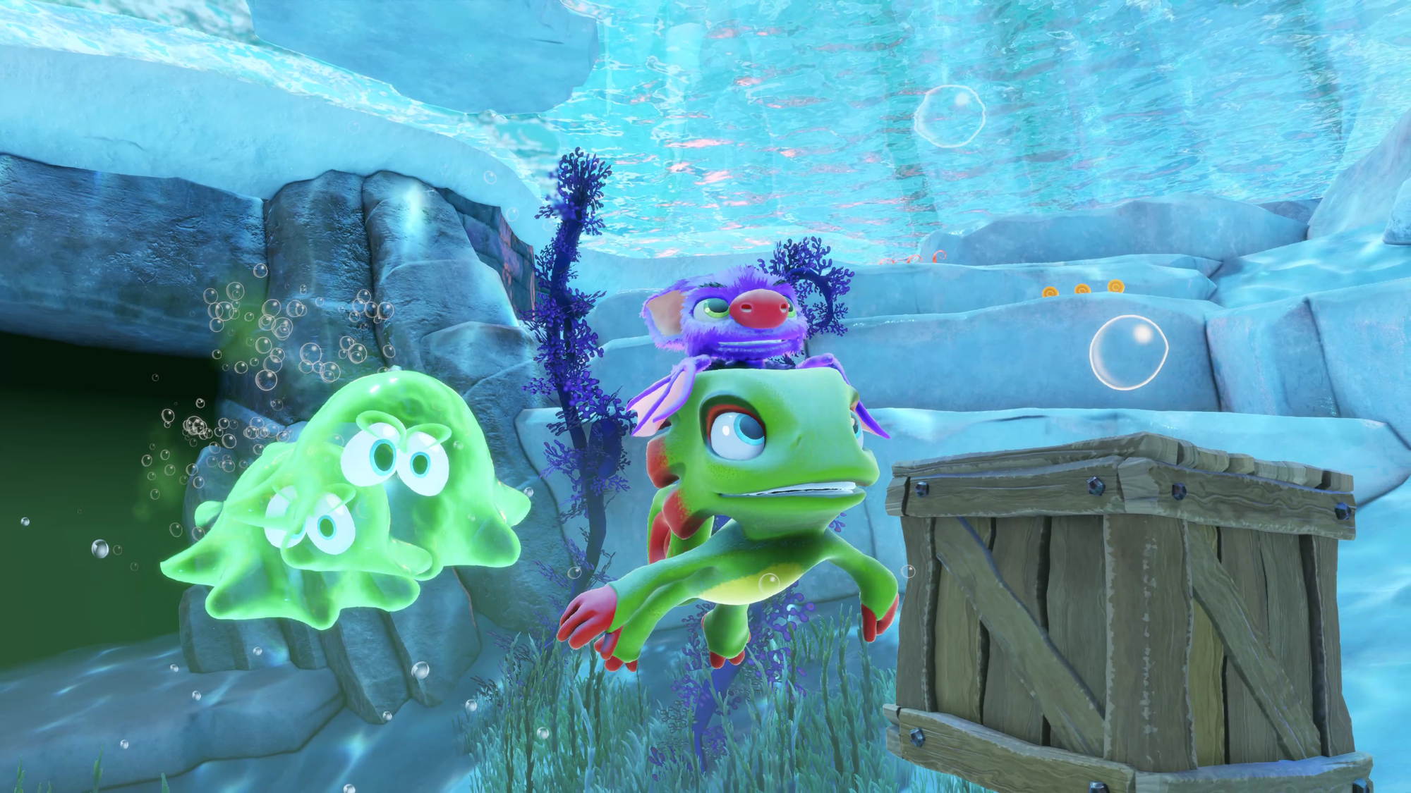 Yooka and Laylee swimming through the sea with two green slimes chasing them down.
