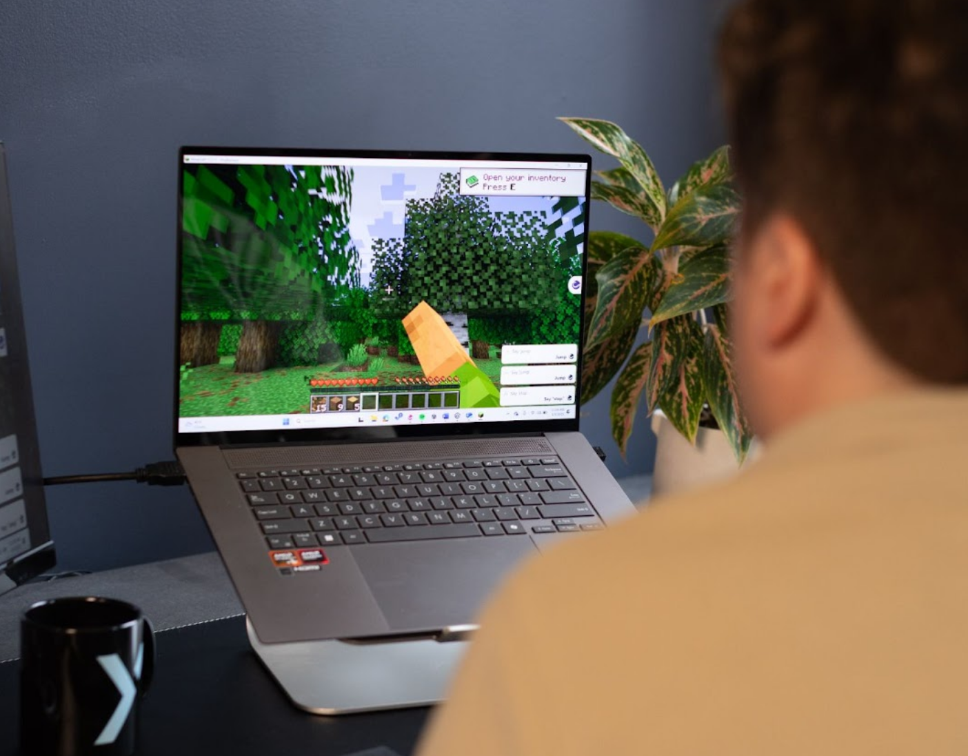 Minecraft being played hands-free on a laptop.