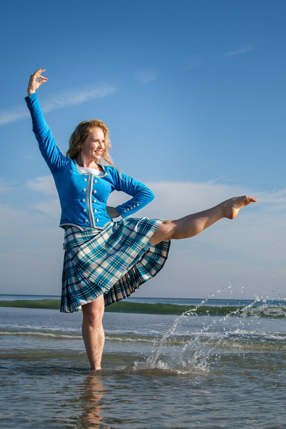 Kasey performs a high kick dance move