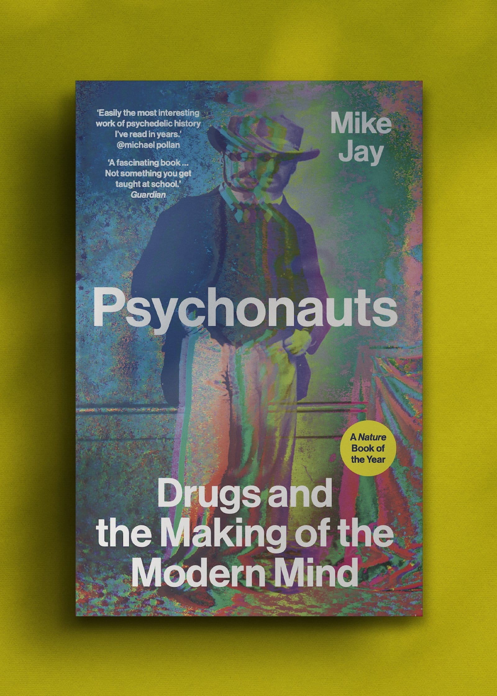 Cover of "Psychonauts" by Mike Jay on a yellow background. Features a multicoloured, psychedelic vintage portrait of a man in a suit and hat. 