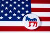 Democratic donkey logo on an American flag