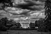 black and white photo of ominous clouds over the White House.