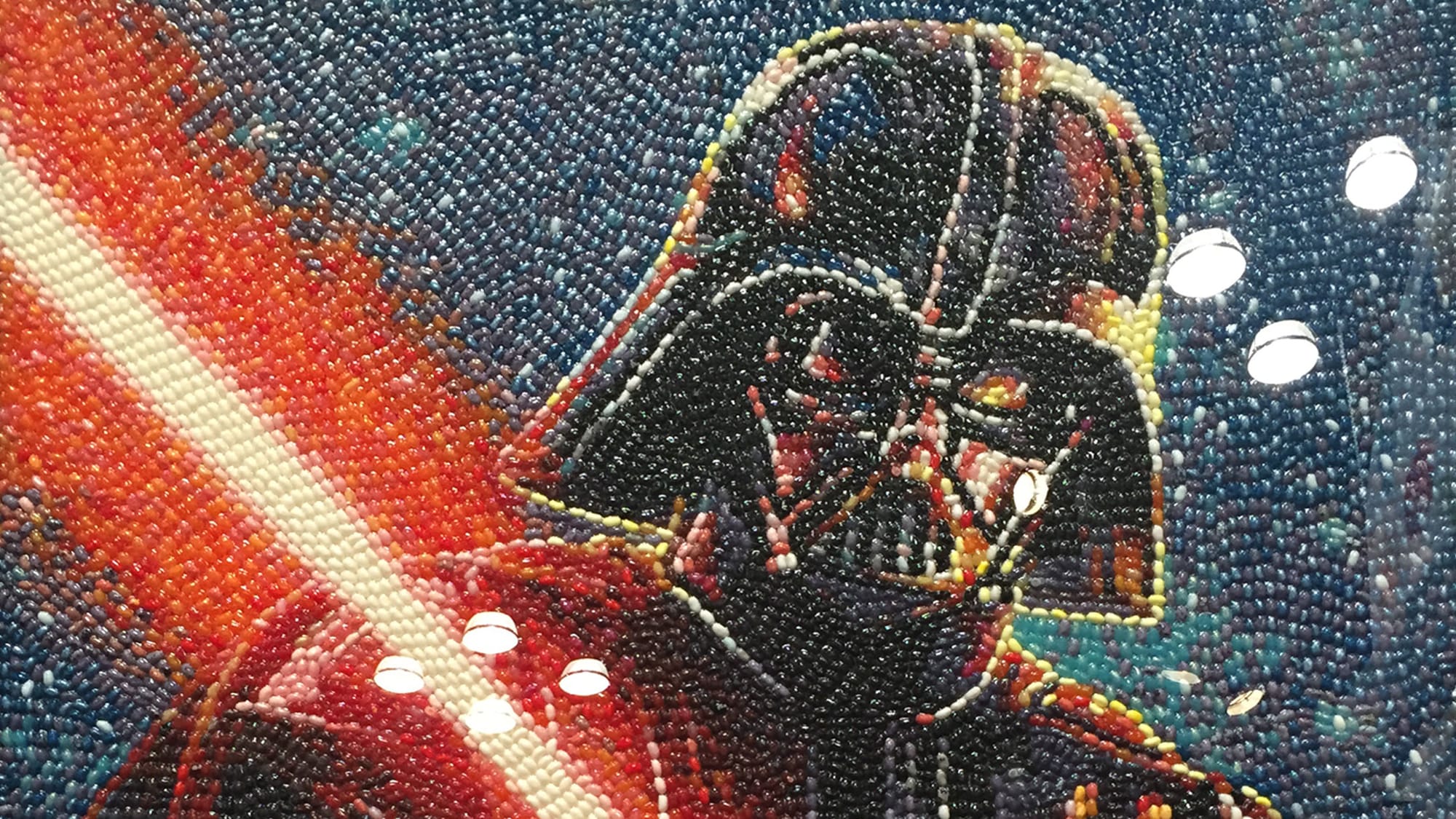 At an earlier Fancy Food Show, a portrait of Darth Vader made entirely of jellybeans, mosaic style. Vader is holding his red lightsaber over one shoulder.