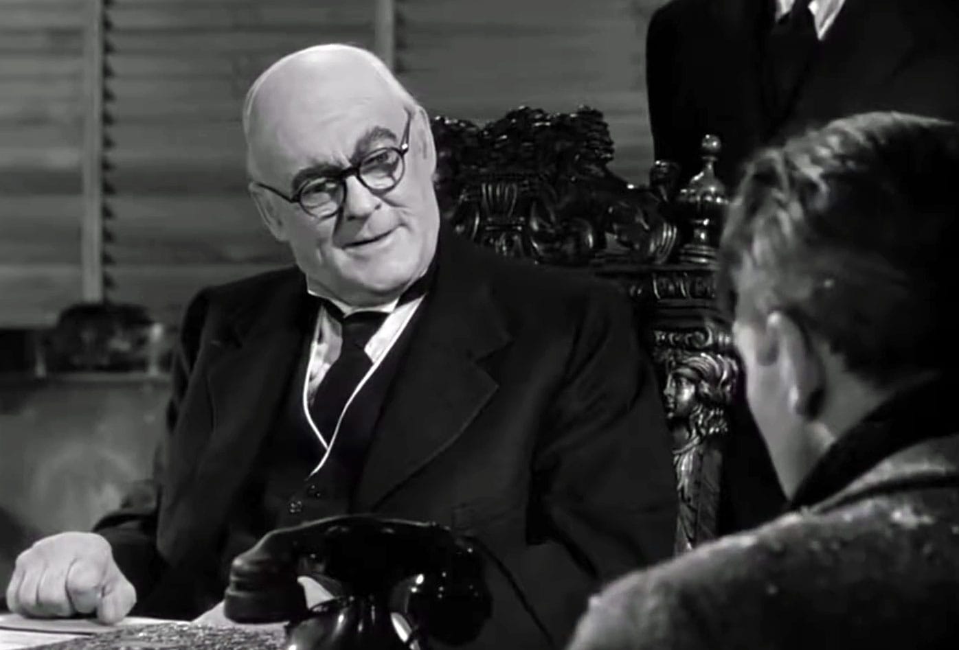 In a screenshot from 'It's A Wonderful Life', Mr. Potter (Lionel Barrymore) relishes humiliating George Bailey, a better man than himself