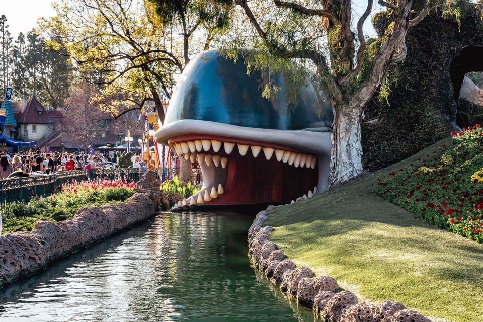 At Disneyland, entering the mouth of a whale in a little boat
