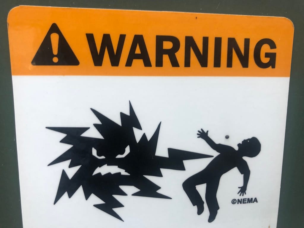 Angry electricity zapping an unwary victim in vintage WARNING sign "©NEMA"