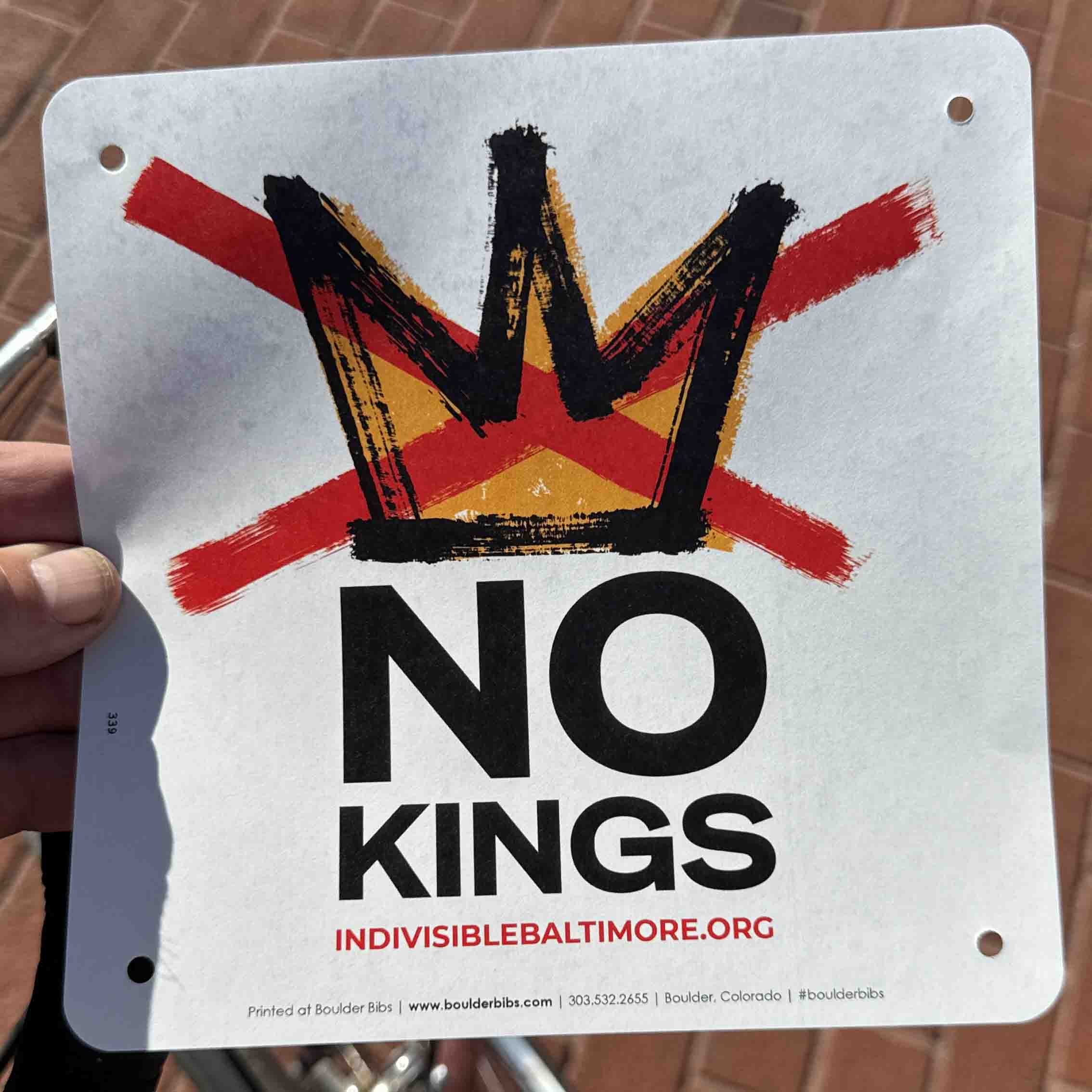 No Kings running bib from indivisiblebaltimore.org in colorful orange, black, red and white