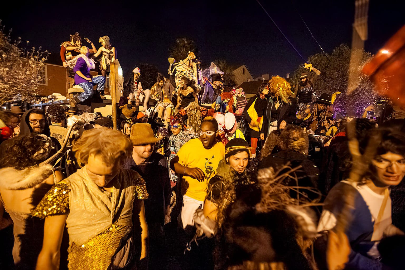 Big crowd of revellers wearing festive costumes