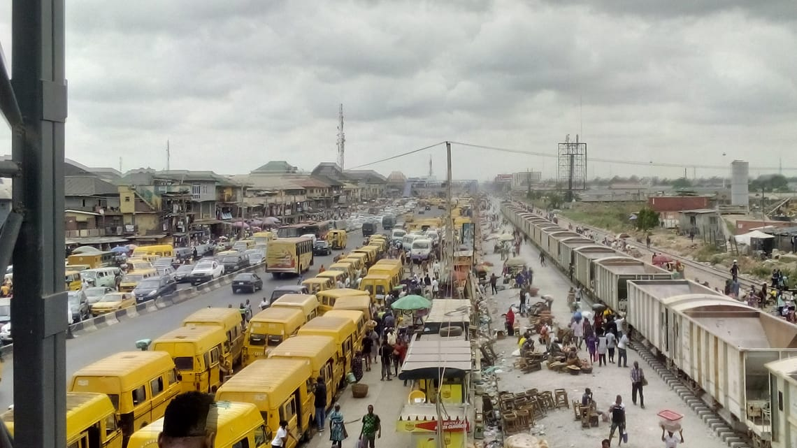 The Highway of Oshodi, Lagos, Nigeria with all form of land and rail way transportation means. 