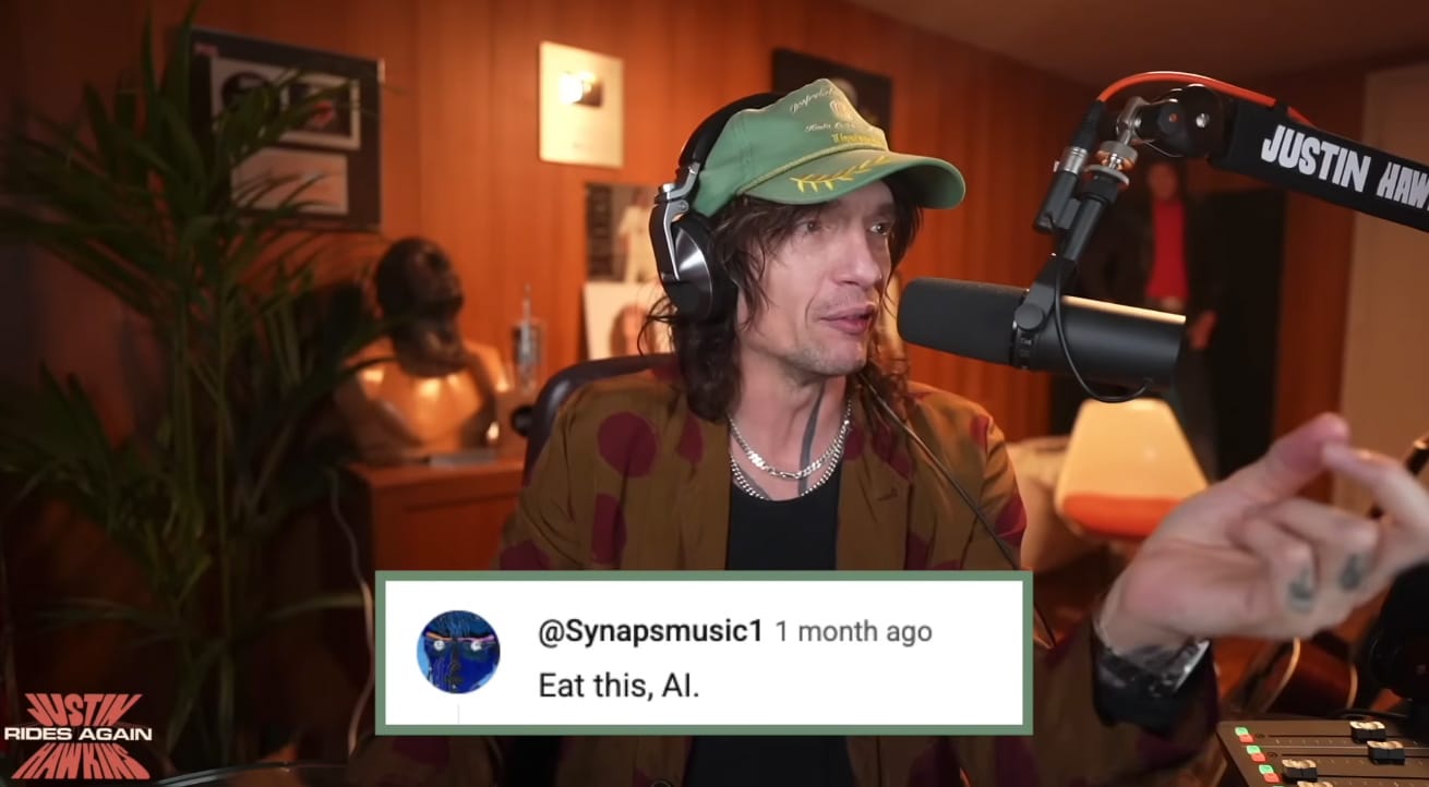 Screen grab from Justin Hawkins Rides Again. Justin H. remarks on the justice of a commenter's observation ('Eat this, AI.') re: Angine de Poitrine