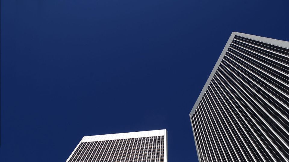 Century City's Century Plaza Towers in LA, stretching high and mighty into a vast, cloudless sky. 