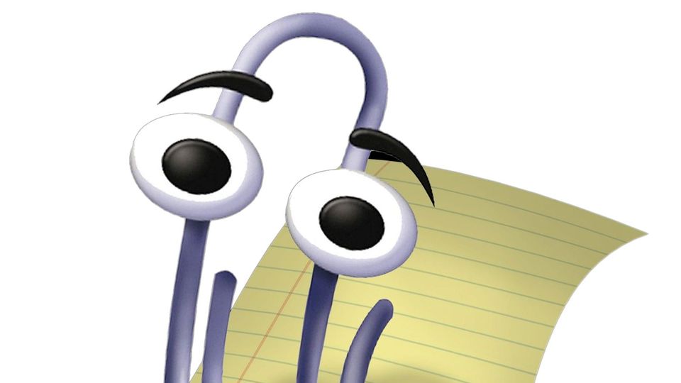 Microsoft Office "Clippy" image over a sheet of yellow lined paper