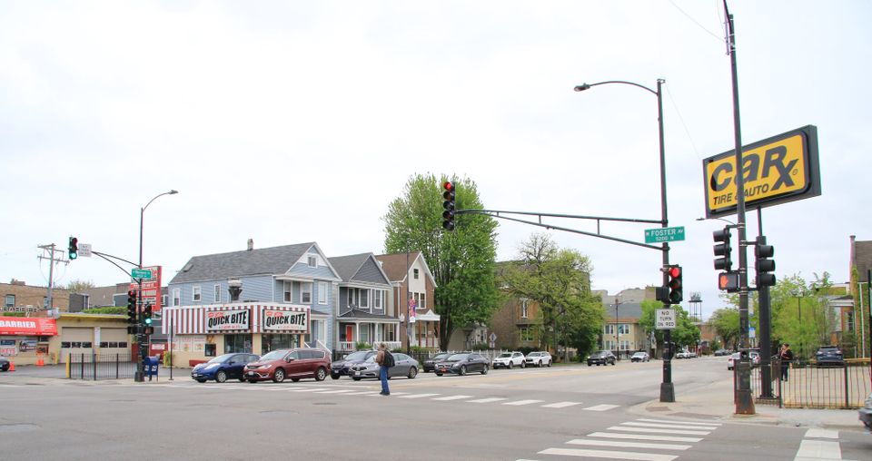 Intersection of Foster and Western, Chicago, daytime, with traffic signals, tire place and Quick Bite across the street