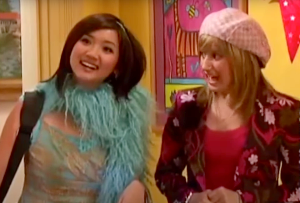 Brenda Song as London Tipton, with her friend Maddie; London wears a turquoise boa and 2000s Tocca-style dress