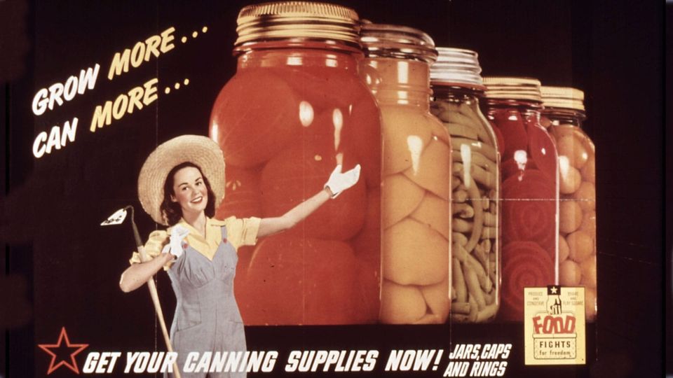An ad for canning from the 1940s features a lovely lady in overals, a hoe, and giant jars of canned food