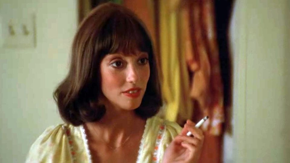 Shelley Duvall in Robert Altman's '3 Women'; smoking a cigarette, wearing yellow gingham and red lipstick