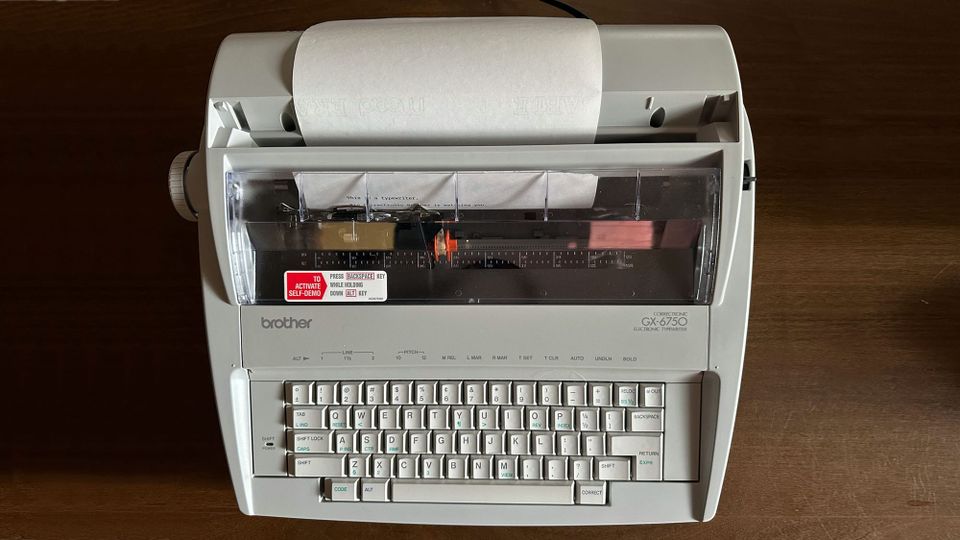 The author's Brother GX-7650 typewriter, seen from above, on a wooden table