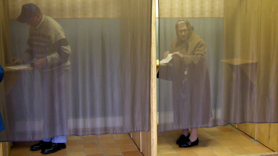 Voting booths with sheer curtains contain Flaming Hydra readers agonizing over which ten blogs to choose
