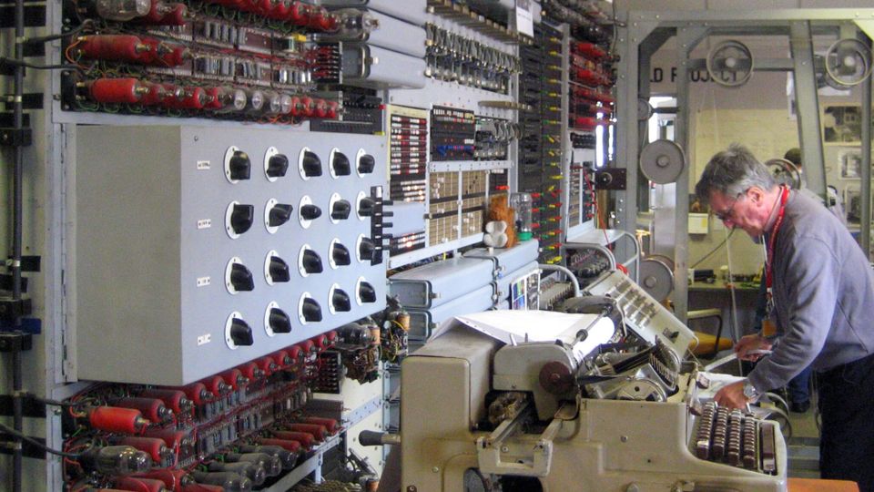 Replica of the 1944 Colossus Mark 2 Computer at The National Museum of Computing, Bletchley Park, UK, with operator