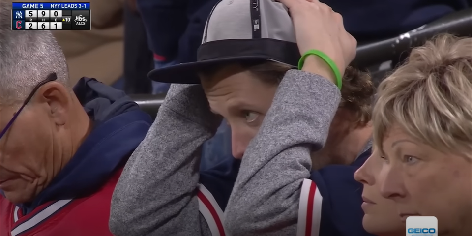 A devastated Guardians fan watches Juan Soto round the bases after hitting a three-run homer