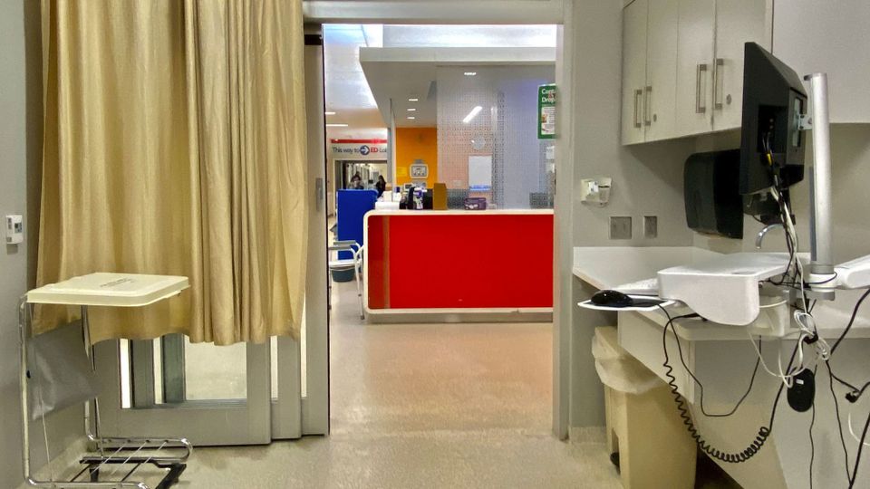 Triage room at Gates Vascular Institute in Buffalo, New York, showing carts, monitors and equipment