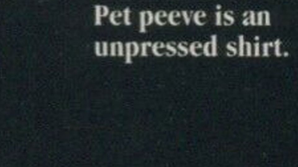 Magnified image from an eBay auction listing of a baseball card, reading, "Pet peeve is an unpressed shirt."