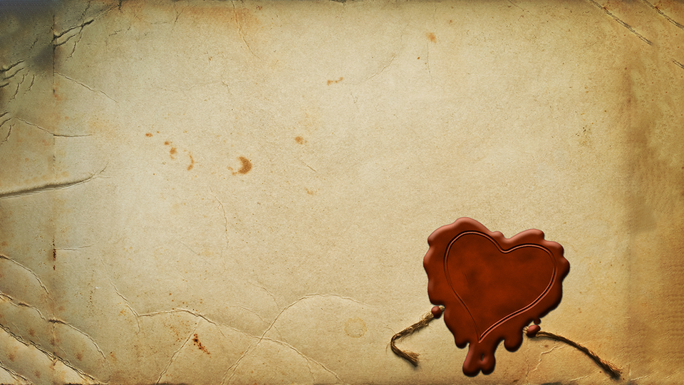 An old-looking weathered envelope affixed with a red wax seal in the shape of a heart