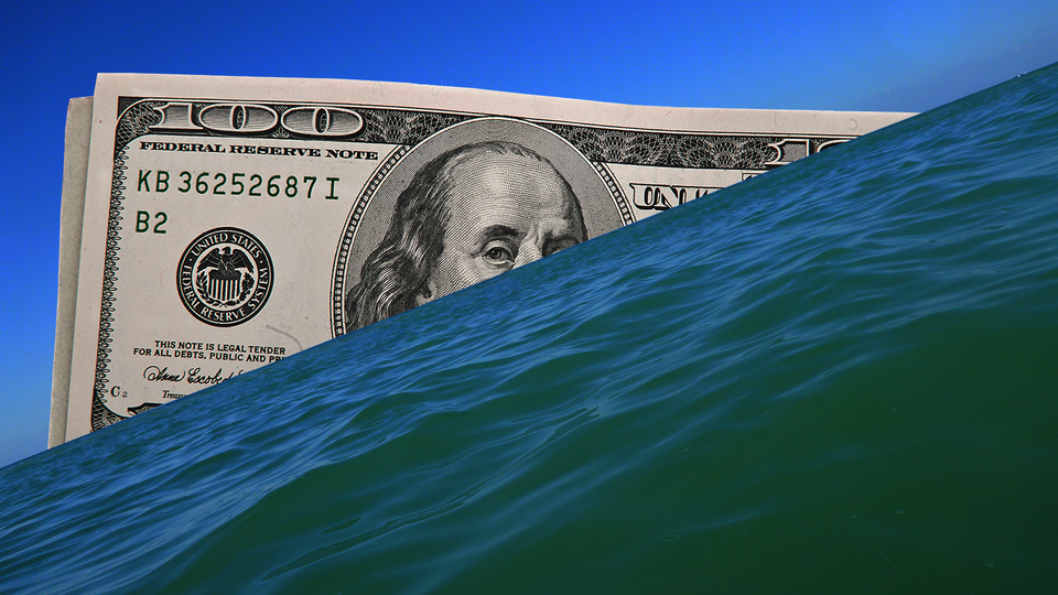 A USD$100 note peeking out of an ocean/horizon view, Benjamin Franklin one eye above waterline.