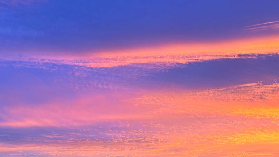 A pink-orange-purple sky can't tell if it's dawn or dusk