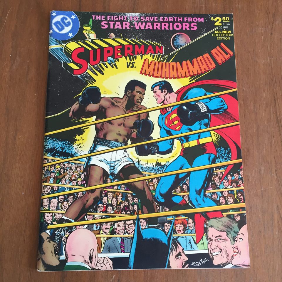Superman and Muhammad Ali in a boxing ring surrounded by celebrities THE FIGHT TO SAVE EARTH FROM STAR WARRIORS - SUPERMAN vs. MUHAMMAD ALI $ 2.50 ALL NEW COLLECTORS EDITION