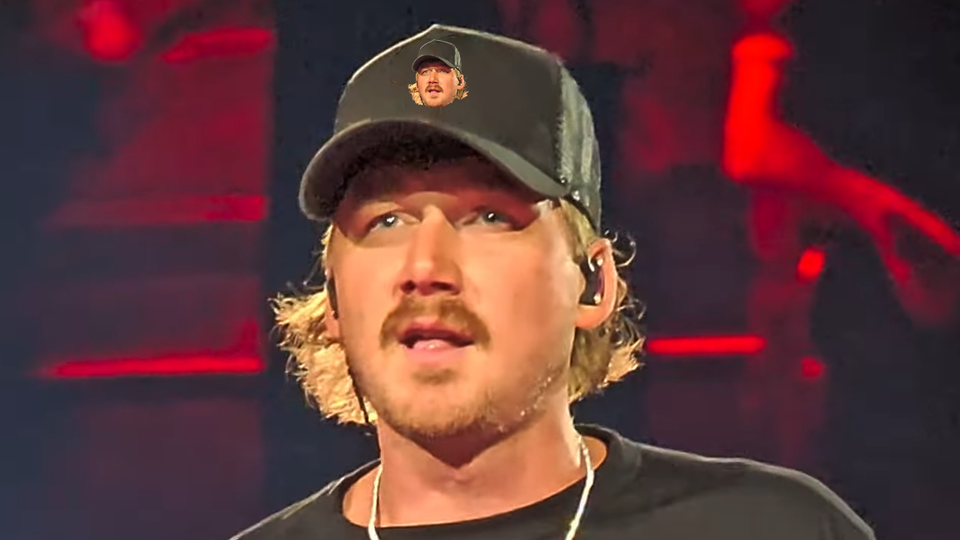 Photo of Morgan Wallen performing You Proof at Bank of America Stadium and the image on his his ballcap has been altered to be a photo of Morgan Wallen