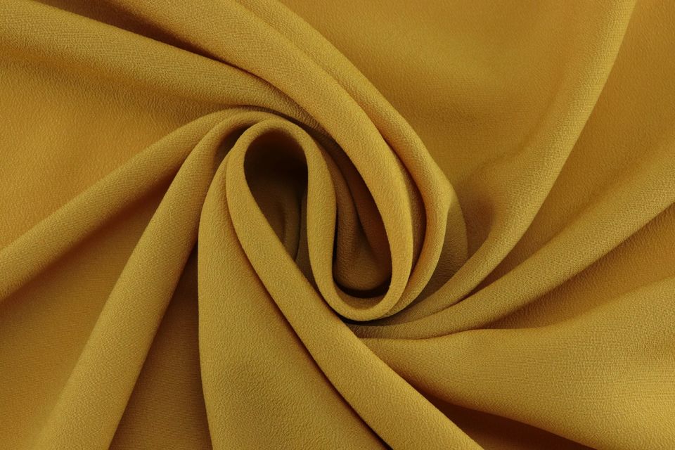 A swirl of soft golden fabric