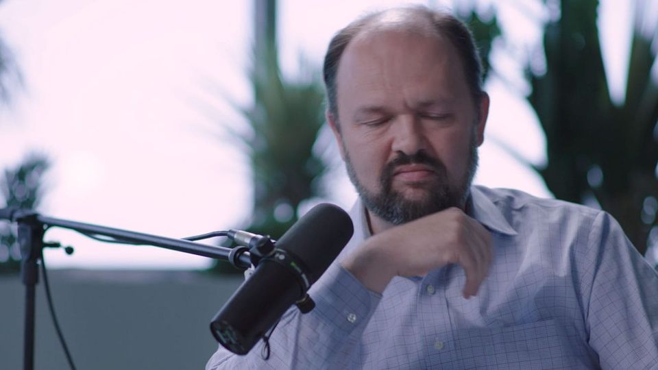 Ross Douthat grimaces in a tormented fashion at the end of 'Peter Thiel and the Antichrist'