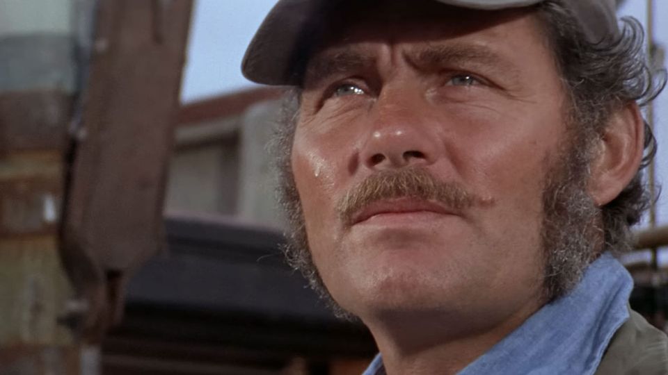 A very handsome movie-star idea of a grizzled old salt: Robert Shaw as Quint in JAWS (1975), looking intently out onto the water